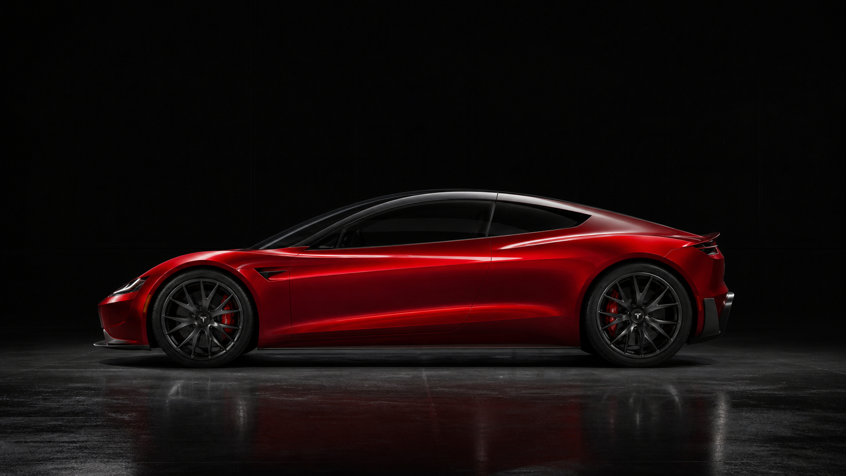 Red Roadster side profile in a dark studio
